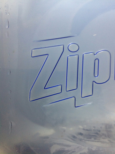 Make an impression. Indentation printing of logo on Ziploc salad container. Zoom to Zip.
